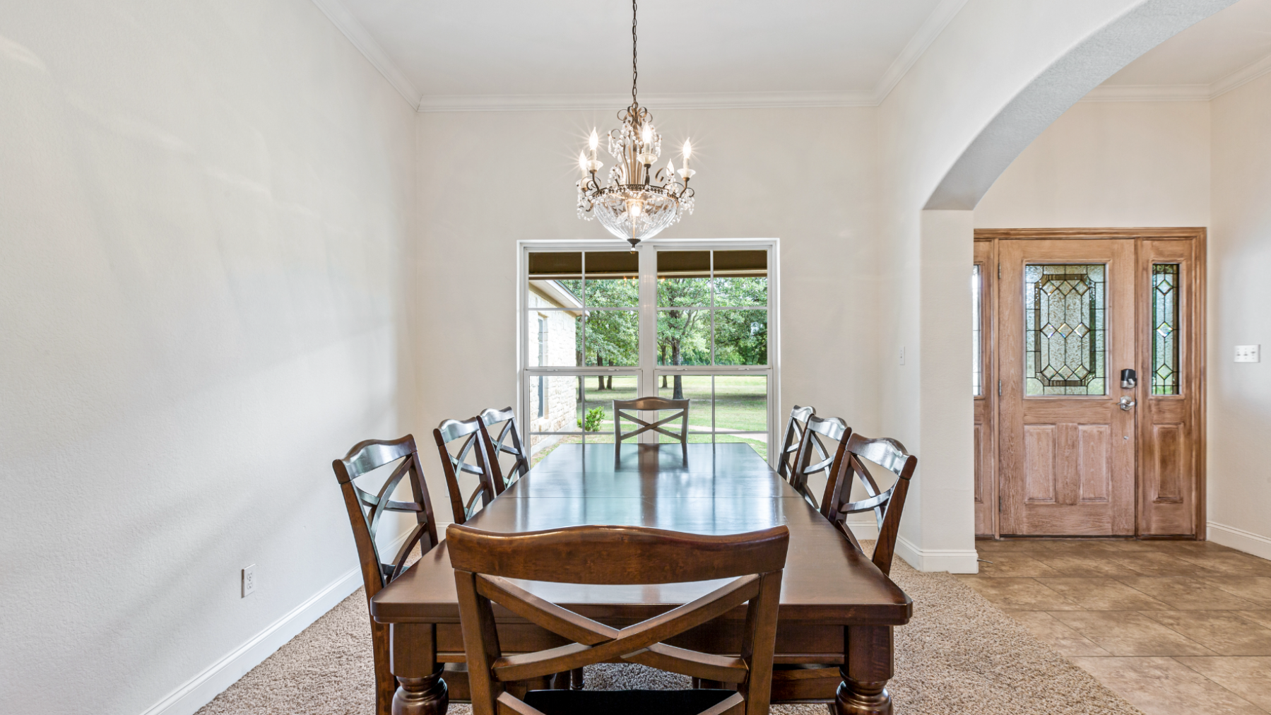 a room filled with furniture and vase on a table